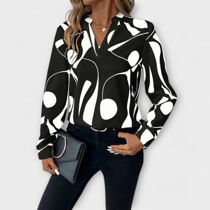 Elegant bluse med lange ermer og spiss hals